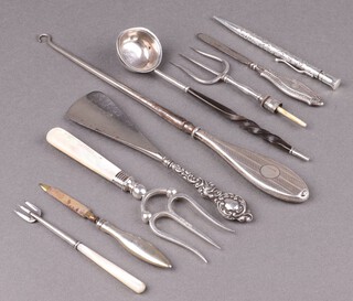A Victorian silver bread fork with mother of pearl handle Sheffield 1882, an embossed silver Yard O Led propelling pencil, a silver handled button hook and other curios 