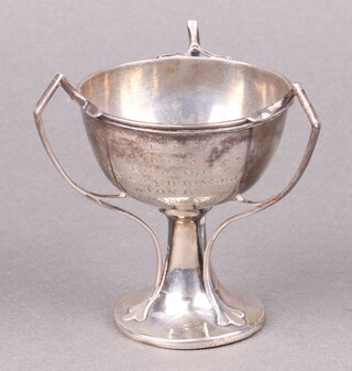 An Art Nouveau 3 handled Continental white metal trophy, base marked WH90, 10cm 
