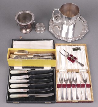 A silver plated salver with bracketed border, a cased set of 6 tea knives with mother of pearl handles, 6 cased pastry forks, pink tankard and other silver plated items 