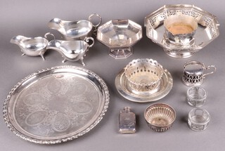 An octagonal pierced silver plated cake basket with swing handle by Mappin & Webb, 3 silver plated sauce boats, ditto salver and other items of silver plated ware 