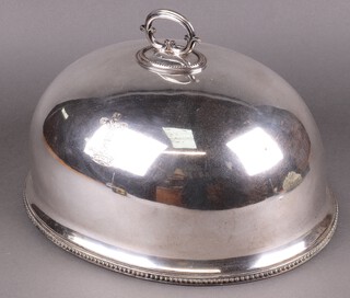 An oval silver plated meat cover with armorial and bead work decoration by The Goldsmiths and Silversmiths Co. 40cm 
