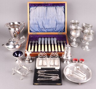 A pair of silver plated nut crackers cased, a pair of silver plated 5 bar toast racks, lemonade jug and other items of silver plated ware, together with a canteen of 6 silver plated fish knives and forks in an oak box 
