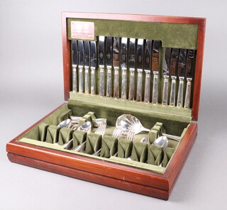 A 59 piece canteen of John Stephenson flatware comprising 8 table knives, 8 table forks, 4 serving spoons, 8 soup spoons, 8 table forks, 8 dessert forks, 8 dessert spoons, 8 tea spoons and a silver plated fruit serving spoon and 6 fruit spoons, all in a teak box 