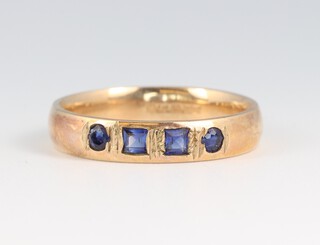A 9ct gold wedding band set 4 sapphires, size O 1/2, 3.2g 