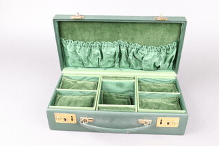 Harrods, a rectangular green leather cantilever jewellery box, the top with gilt monogram JG, 8cm h x 30cm w x 15cm d 