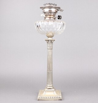 A cut glass and silver plated oil lamp, raised a silver plated column with Corinthian column capital and cut glass reservoir 42cm 