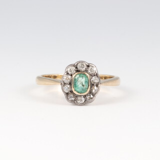 A 9ct gold emerald and diamond cluster ring, size L, 2.6g