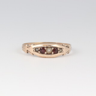 A gold testing as 9ct ruby and pearl set ring, size N 1/2, 1.7g