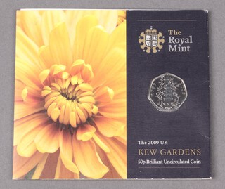 A 2009 Kew Gardens 50 pence coin, uncirculated in original packaging 