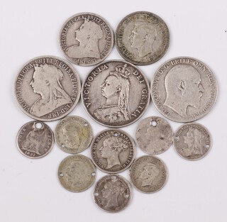 A collection of pre-1947 silver coinage to include shillings, florins and thruppences, 57.2g 