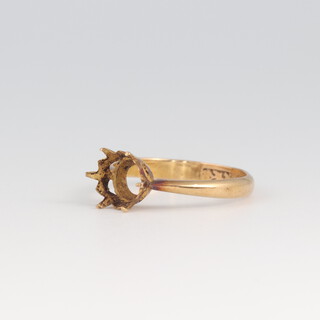 A gold ring mount (hallmarks rubbed) testing as 18ct, size K, 2.4g