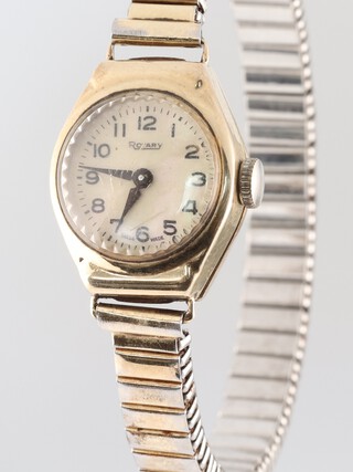 A lady's Rotary wristwatch with mother of pearl effect dial Arabic numerals, the movement marked 15 jewels 790, contained in a 9ct gold case on a gilt metal expanding bracelet 
