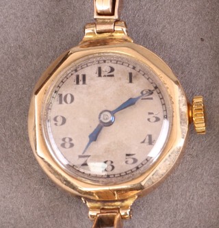 A lady's 5 jewel wristwatch with silver jewel, Arabic numerals, contained a 9ct gold case marked Stolkace and with integral 9ct gold expanding bracelet, 12g gross 