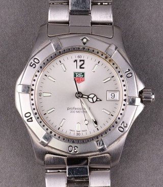Tag Heuer, a gentleman's Tag Heuer WK112-0 wristwatch, the silvered dial with calendar aperture, contained in a steel case with integral bracelet, complete with spare link, booklet and card, boxed 