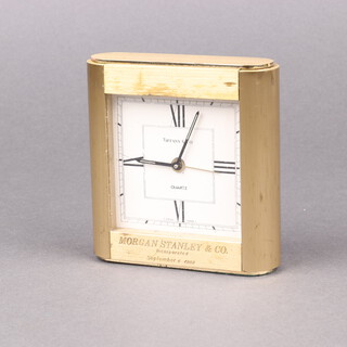 Tiffany & Co., a quartz alarm clock, the square white dial marked Tiffany & Co quartz, inscribed Morgan Stanley & Co Incorporated 6 September 1983, 11cm h x 9cm w x 3cm d 