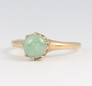 A gold marked 18K ring, set a jade coloured stone, size M, 2.4g
