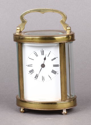 A 20th Century French 8 day carriage timepiece with enamelled dial Roman numerals contained in a gilt metal case, complete with key 11cm h x 8cm w x 6cm d 