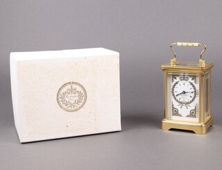 Garrards for Buckingham Palace Royal Collection Enterprises, a limited edition carriage clock with enamelled dial marked Buckingham Palace with laurel leaves surmounted by a crown, no.24/100, 11cm h x 8cm w x 6cm d, complete with certificate and box 