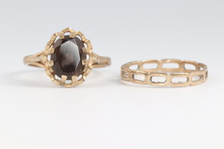 A 9ct gold ring size O, 0.9g together with a 9ct gold dress ring size O, 2.6g