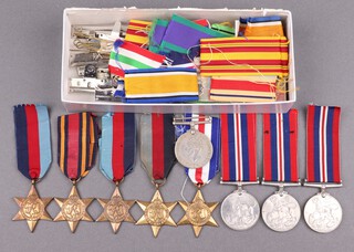 A 1939-45 Star, a Burma Star, 4 Second World War British War medals, a facsimile France and German Star together with various ribbon mounting and mounting bars 