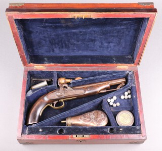 A 19th Century percussion pistol with 21cm octagonal barrel, stirrup ram rod and a reproduction embossed copper powder flask, all contained within a wooden carrying case 