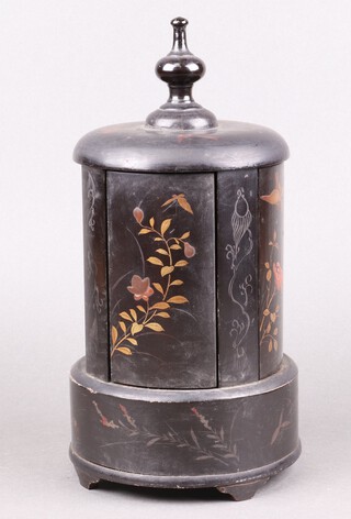 A 1930's cylindrical black lacquered chinoiserie style cigarette dispenser enclosed by 4 panelled doors, raised on bun feet (1 foot missing) 32cm 