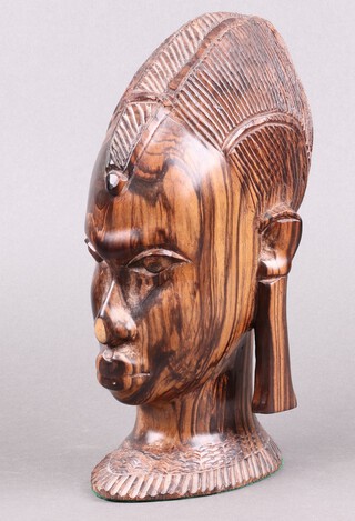 A carved African hardwood portrait bust of a lady 26cm 