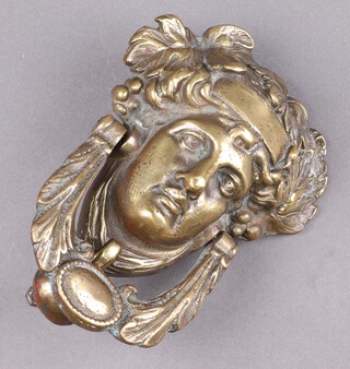 A 19th Century cast brass door knocker in the form of a portrait of Dionysus 19cm x 14cm 