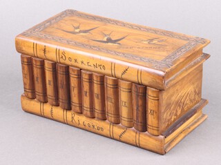 A 19th Century Italian inlaid olive wood puzzle box, the lid inlaid birds, the front in the form of books marked Sorrento Ricordo 11cm h x 23cm w x 12cm d 