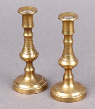 A pair of 17th Century brass candlesticks 10cm
