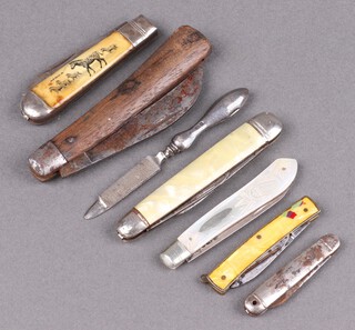 A silver bladed folding fruit knife with mother of pearl grip marked Saynor, a folding pruning knife the blade marked Senior Sheffield England with wooden grip (light rust), 4 other folding fruit knives and a silver handled nail file 