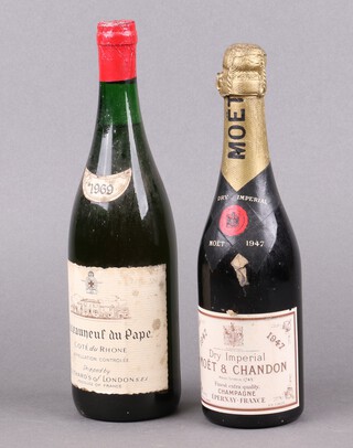 A half bottle of 1947 Moet and Chandon champagne together with a 1969 bottle of Chateauneuf du Pape Cotes du Rhone