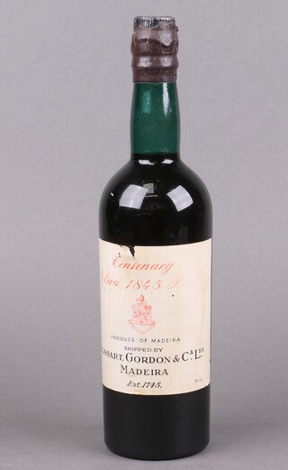 A bottle of 1845 Centenary Solera Bual Madeira wine shipped by Cossart Gordon and CA. LDA. 