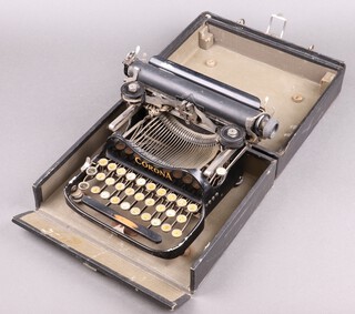 A Corona III portable manual typewriter complete with carrying case 
