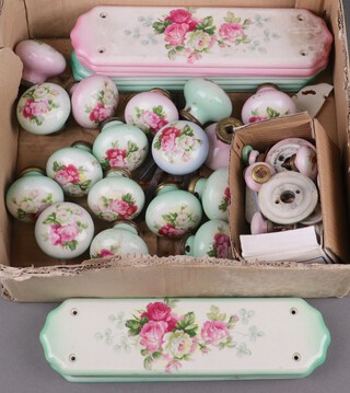 Nine green glazed floral porcelain finger plates, the reverse marked 169BLD 27cm x 7cm (1 a/f), 11 matching door knobs, 3 pink porcelain floral patterned finger plates 27cm x 7cm, 4 matching door knobs and other door fittings