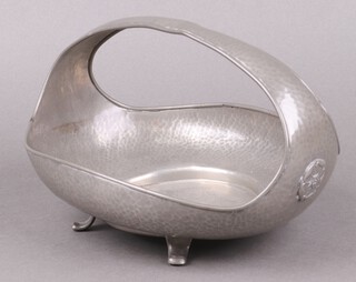 A Warric oval Arts and Crafts planished pewter bowl with Tudor rose decoration, base marked 6008 27cm 