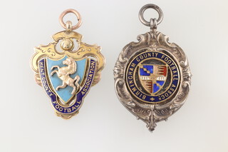 Two football medals awarded to former Tottenham Hotspurs goalkeeper Bill (William) Jaques (1888-1925) to include a 9ct gold enamelled Kent County FA medal the reverse inscribed "Senior Cup Winners W Jaques 1909-1912" ( Northfleet United defeated Chatham 2-0) together with a silver enamelled Birmingham County FA medal the reverse inscribed "1912 Junior Match V Scotland W Jaques"

Please note: Jaques Tottenham FA cup winners medal is lot 740 and a pocket watch presented to him by the Directors of Tottenham Hotspur FC is lot 558