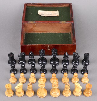 A set of British Chess Companies Staunton Club Chessman no.4 (medium loaded) contained in a mahogany hinged box with original label, 32 pieces in boxwood and ebony (the knights appear to be a different material) Kings are 9cm high 
