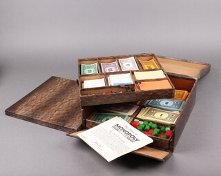 A rare 1930's Monopoly Deluxe Edition in faux snakeskin fitted 2 drawers together with 2 other early Monopoly sets 
