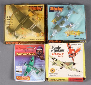 A collection of boxed Dinky Toys aircraft to include a Hawker Harrier 722, Junkers JU 87B Stuka, a Battle of Britain Spitfire MK2 719 and a Matchbox Sky Busters SB-7 Junkers 87B 