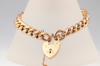 A 9ct gold curb link bracelet with padlock clasp, 18cm, 14.9g 
