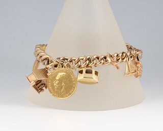 A 9ct gold charm bracelet with padlock clasp, hung 12 numerous charms including a 1918 full sovereign and a 1911 half sovereign, gross weight 46.3 grams