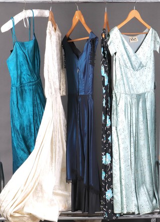 A lady's 1950's D Lynn turquoise sleeveless day dress, a Linzi Line blue floral day dress, an unmarked blue sleeveless evening dress, a black evening dress labelled "This For you by B Lanes", an unmarked full length wedding dress and a blue evening dress (5) 