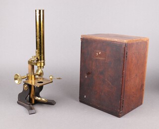 A Husband & Clark single pillar microscope together with 23 various glass slides