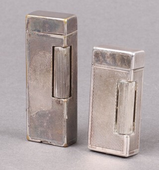 Two Dunhill silver plated lighters (1 seized) 