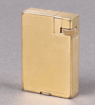 A gold plated Dunhill lighter with engine turned decoration 