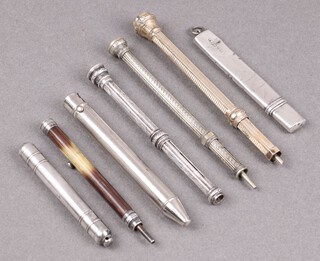 A silver pencil case with pencil (marks rubbed and dented), a silver propelling pencil, a gilt cased ditto, 2 others, a porcupine cased ditto, a Crayon Hindou ditto 