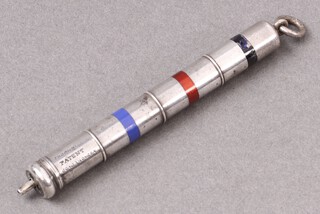 A Thornton Hill patent tri-colour propelling pencil with 3 enamelled bands to the metal centre, 8cm 