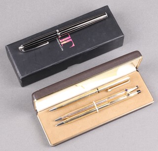 A Cross ballpoint pen contained in a gilt case marked Made in The USA 20KT gold filled, a gilt cased fountain pen with Tudor Rose monogrammed clip marked Walt Disney Products and a cased Thomas Lyte fountain pen in a marked 925 enamelled case  