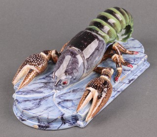 A Continental pottery figure of a lobster on an oval shaped base 23cm 
